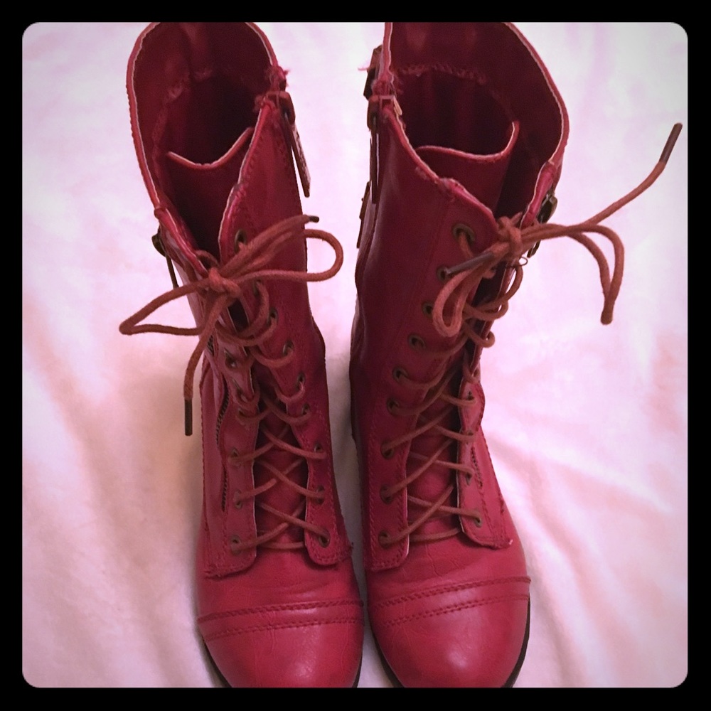 Red faux leather boots.